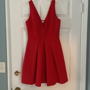 This red knee length dress is perfect for a wedding or special occasion.